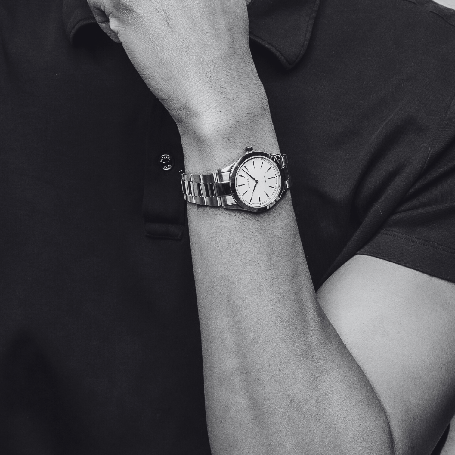 Two men wearing a black shirt and stainless steel watches