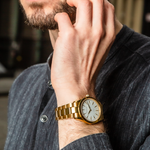 man wearing gold an white watch from Duku & Co.